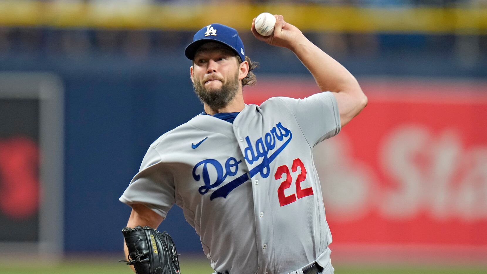 Los Angeles Dodgers starting pitcher Clayton Kershaw delivers to the Tampa Bay Rays during...