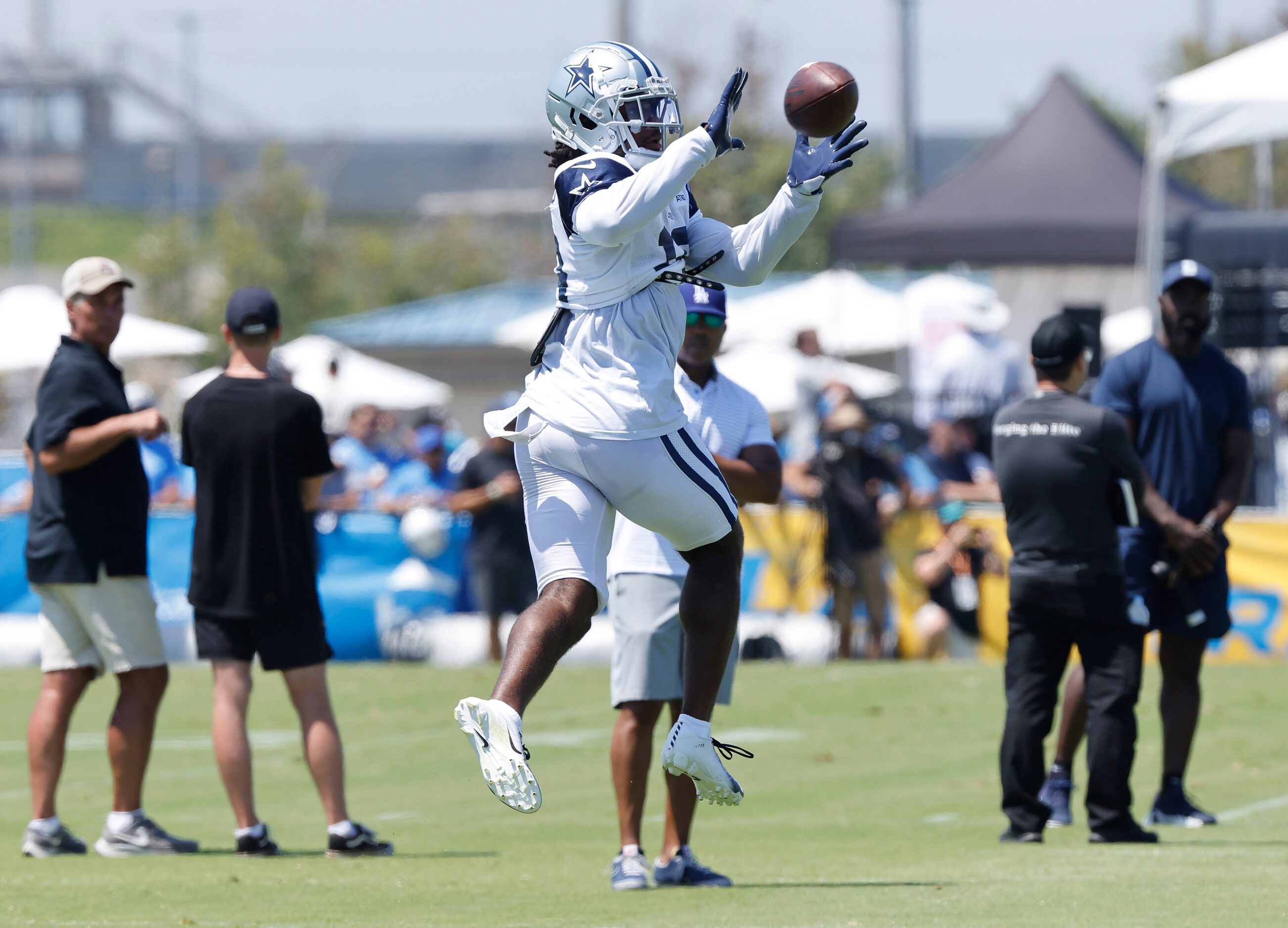 Dallas Cowboys wide receiver Jalen Tolbert (18) pulls down a pass during a joint practice...