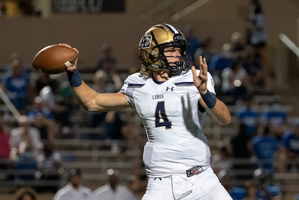 Little Elm senior quarterback John Mateer (4) throws a pass during the first half of a high...