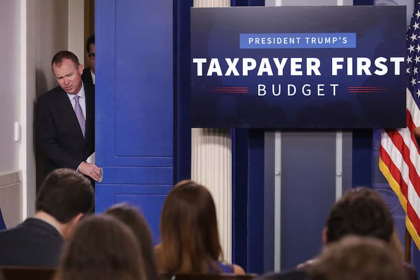 Office of Management and Budget Director Mick Mulvaney arrives for a news conference to...