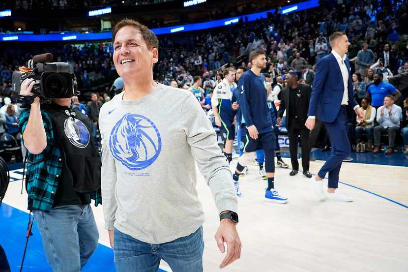 FILE - Mavericks owner Mark Cuban celebrates after a 109-91 win against the 76ers at...
