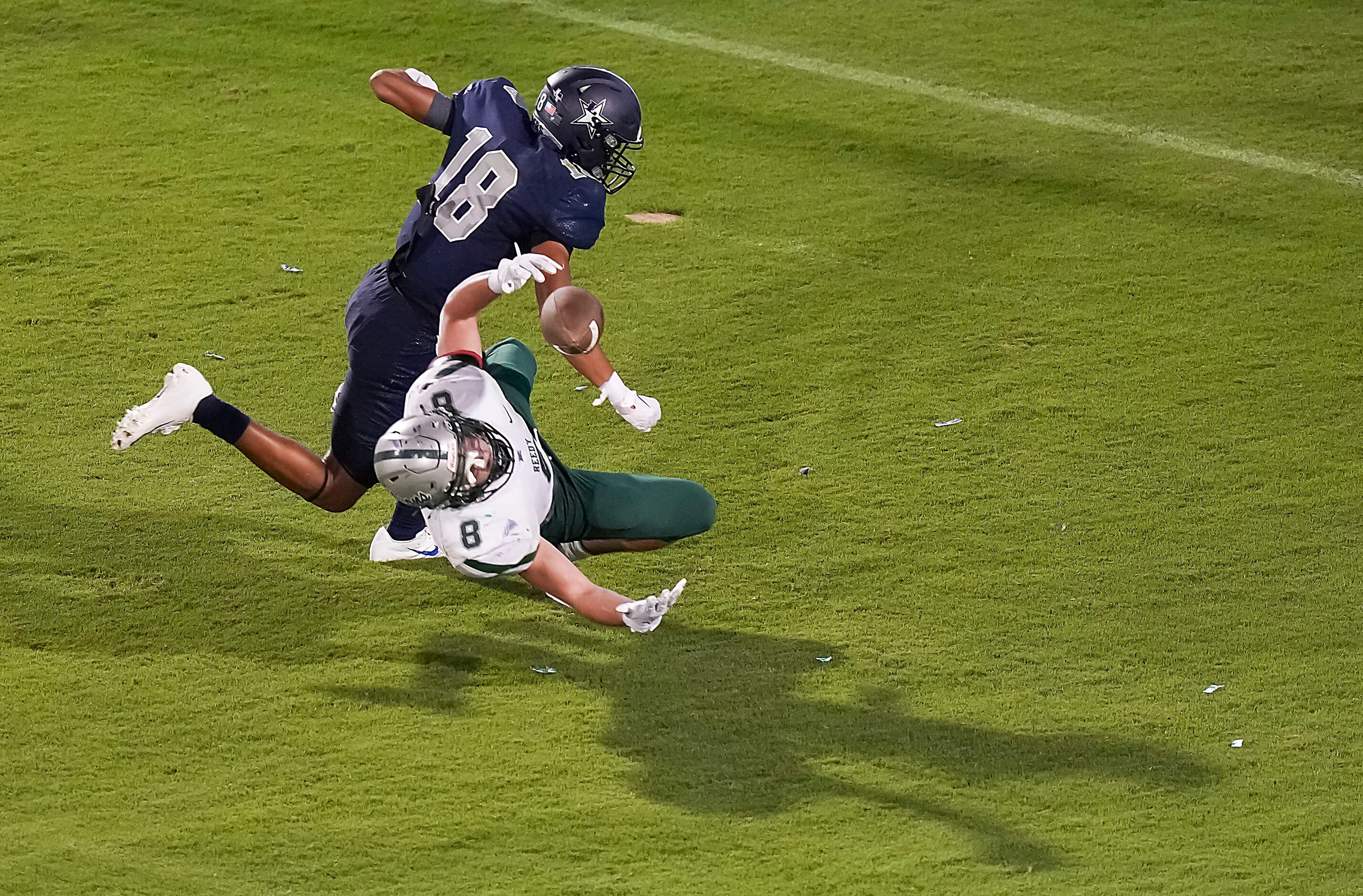 Frisco Lone Star’s Jordan Deck (18) breaks up a pass intended for Frisco Reedy’s Darren...