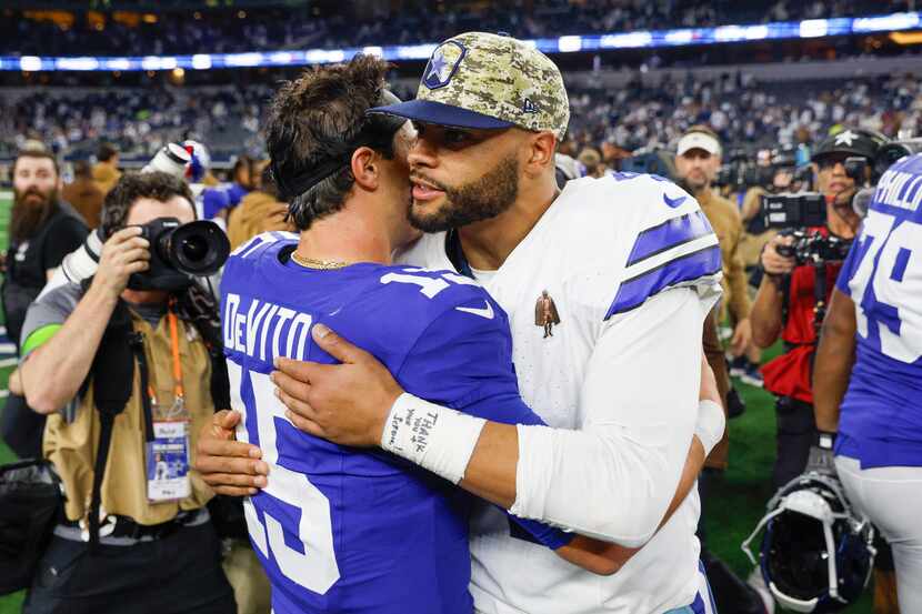 Dallas Cowboys quarterback Dak Prescott (4) greets New York Giants quarterback Tommy DeVito...