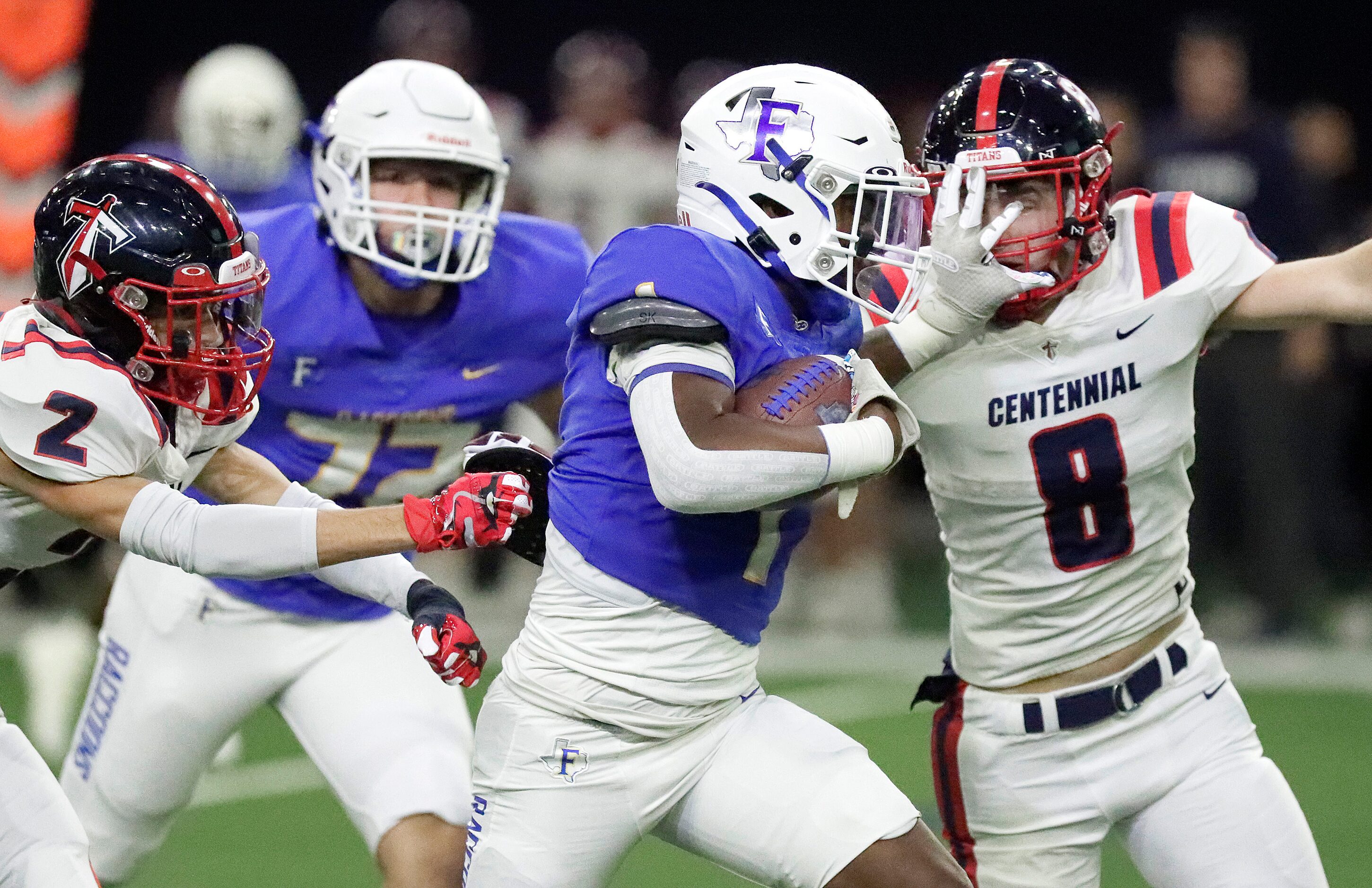 Frisco High School running back Kam Pendergraph (1) eludes Centennial High School defensive...