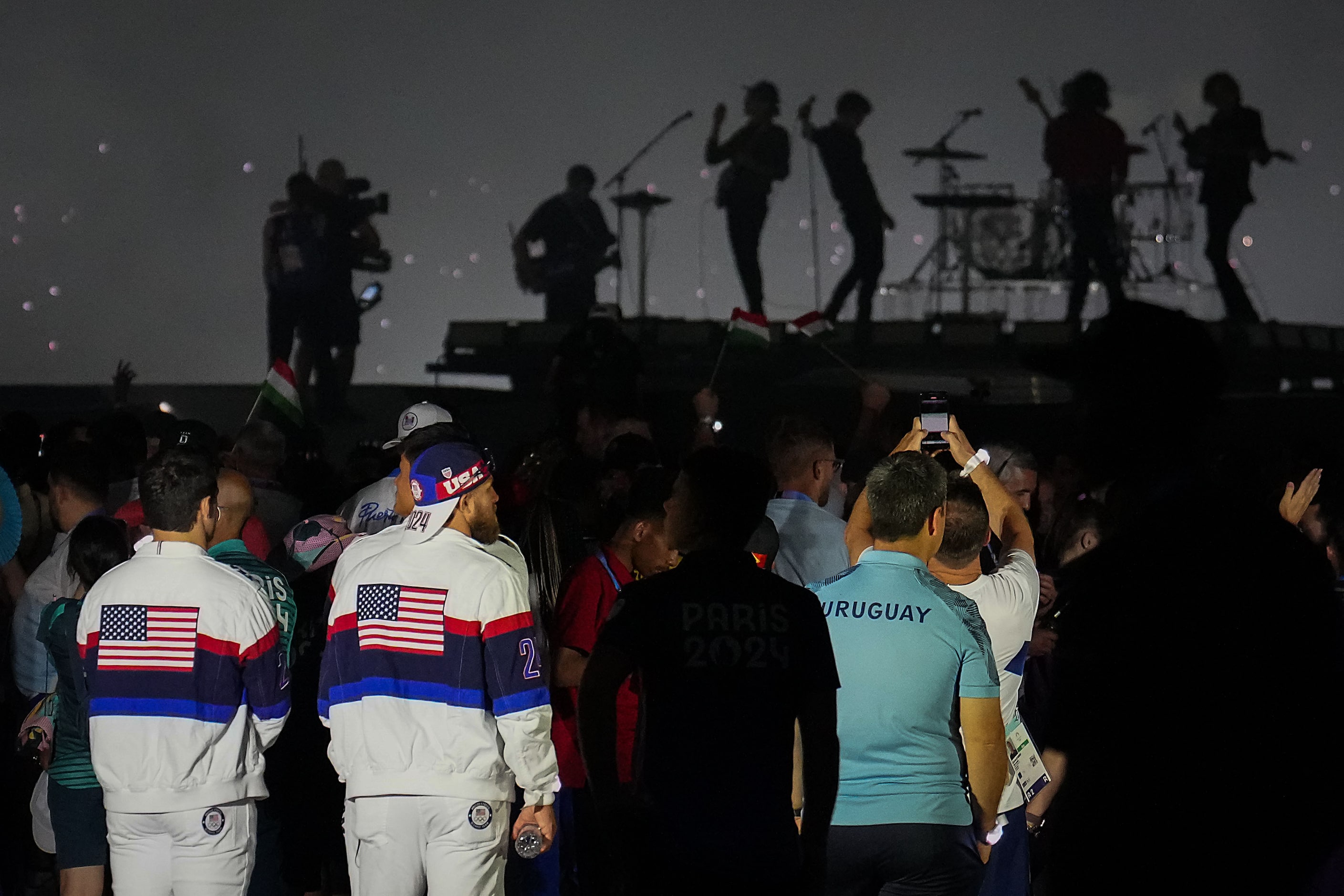 Athletes watch the band Phoenix perform during closing ceremonies for the 2024 Summer...