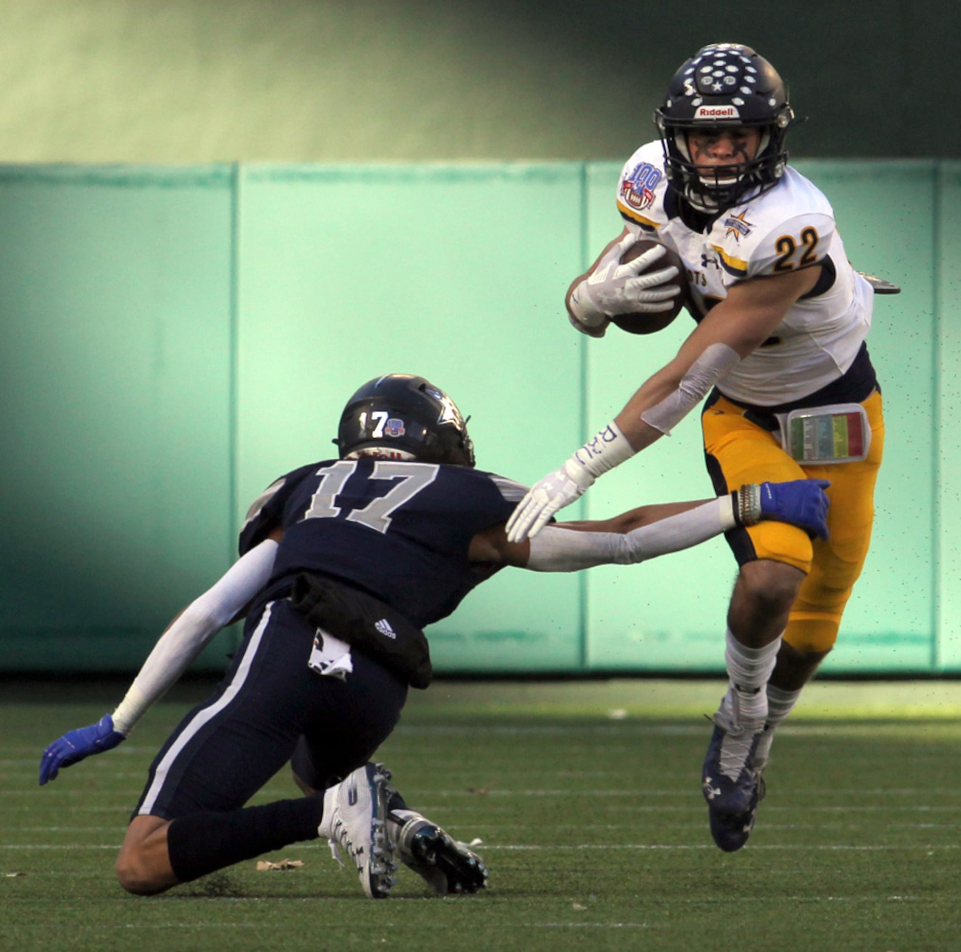 Highland Park running back Brooks Bond (22) avoids the tackle attempt by Frisco Lone Star...