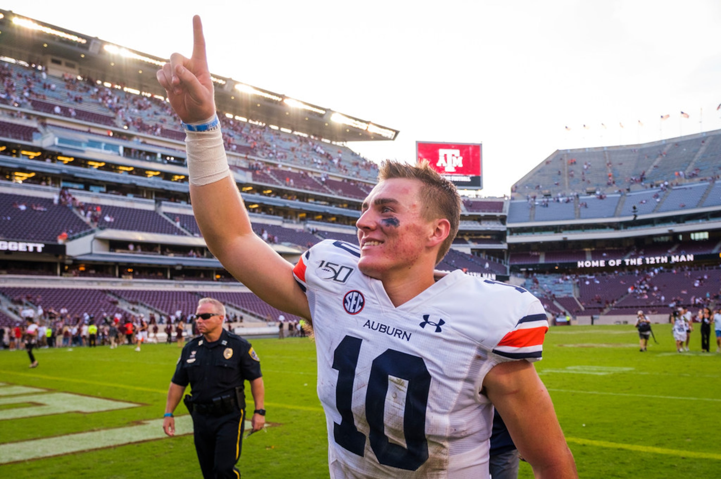 Auburn quarterback Bo Nix celebrates as he leaves the field after a victory over Texas A&M...