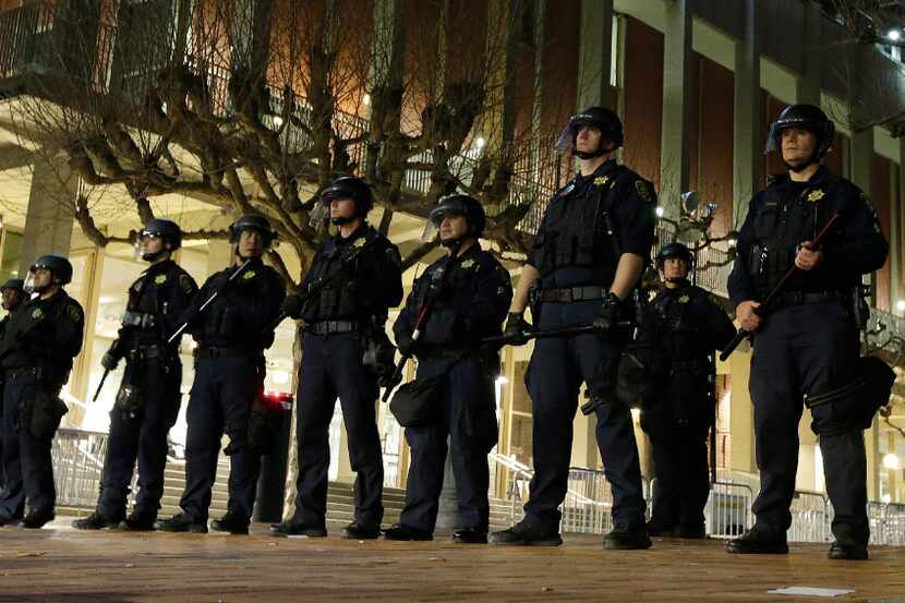 In this Feb. 1 photo, University of California at Berkeley police guard the building where...