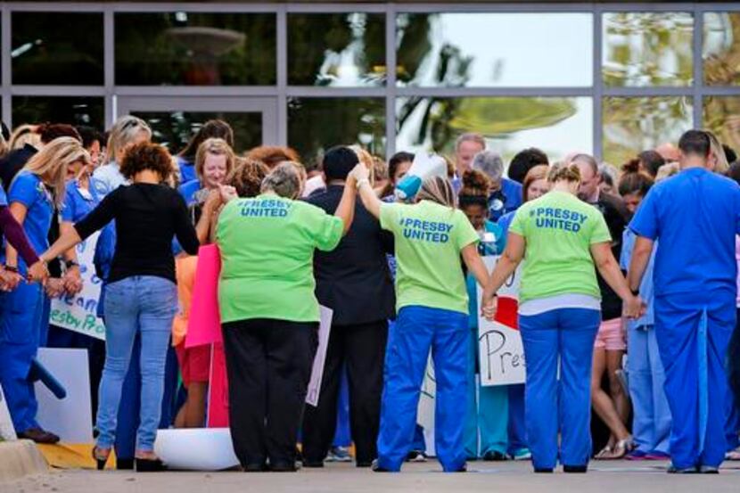 
Personnel rallied Friday at Texas Health Presbyterian Hospital Dallas. “We’re in and out....