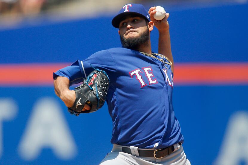 NEW YORK, NY - AUGUST 09:  Martin Perez #33 of the Texas Rangers pitches in the first inning...