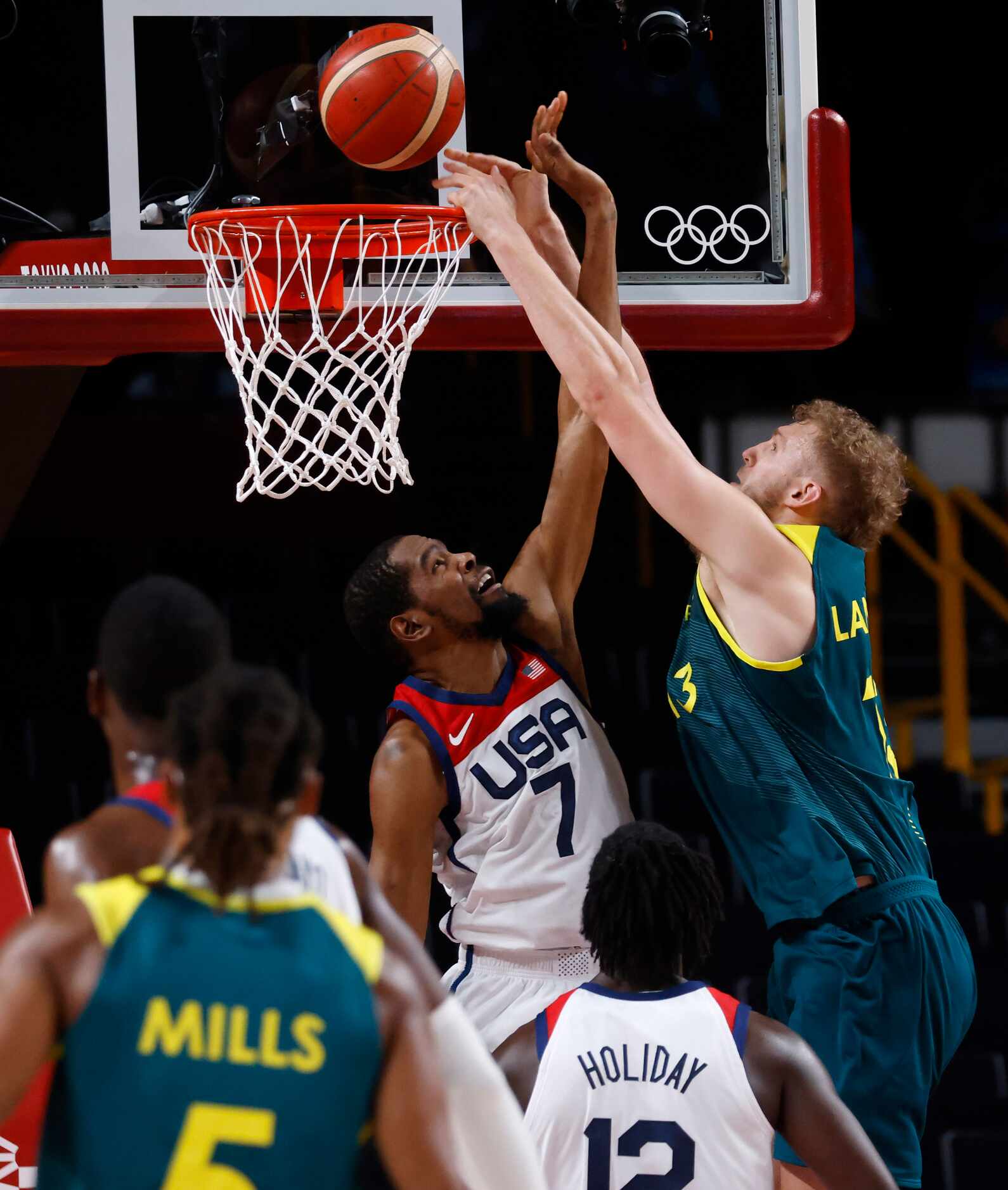 USA’s Kevin Durant disrupts a dunk attempted by Australia’s Jock Landale (13) during the...