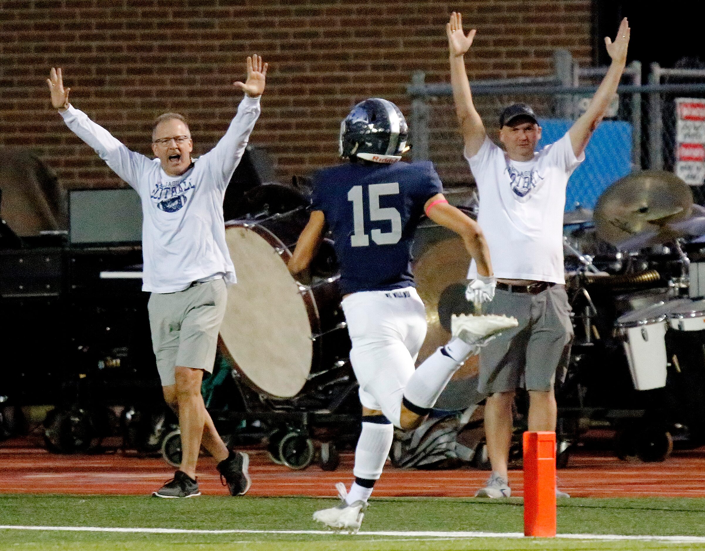 Flower Mound High School wide receiver Walker Mulkey (15) scores the games first touchdown...