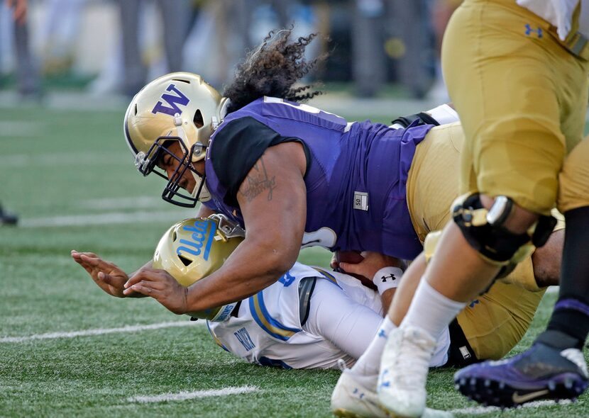 FILE - In this Oct. 28, 2017, file photo, Washington's Vita Vea sacks UCLA quarterback Josh...