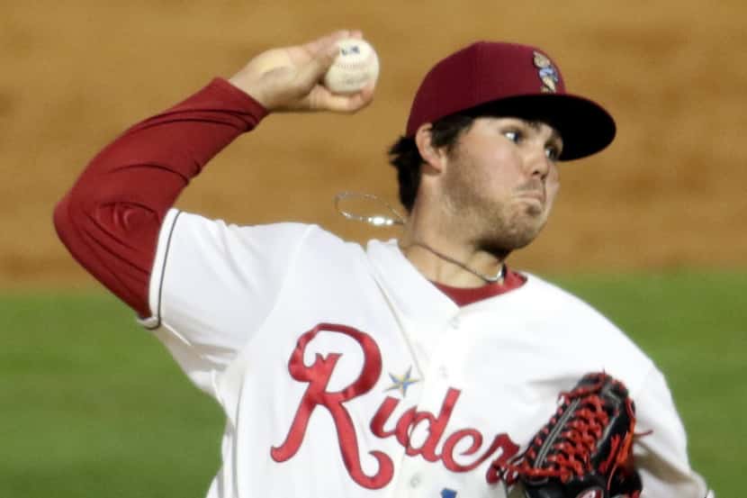 Frisco RoughRiders pitcher Cody Buckel (13) delivers a pitch to an Arkansas Travelers batter...