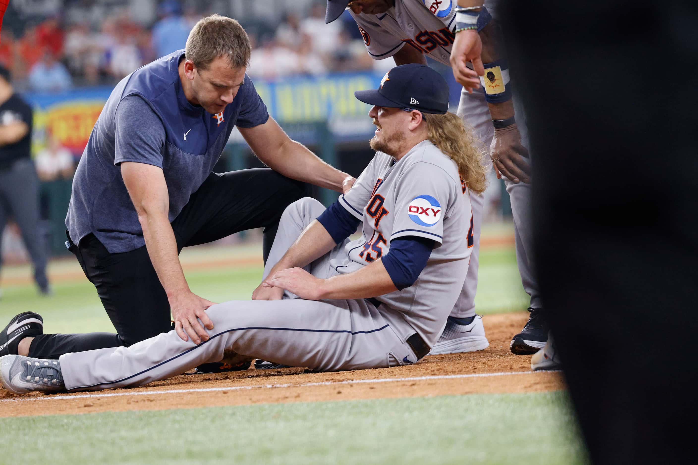 Houston Astros relief pitcher Ryne Stanek (45) is seen after he injured during the ninth...