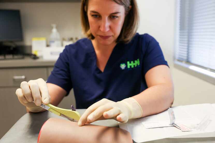 Whitney Parks demonstrates the administration of Nexplanon at an HHM Health office in Dallas.
