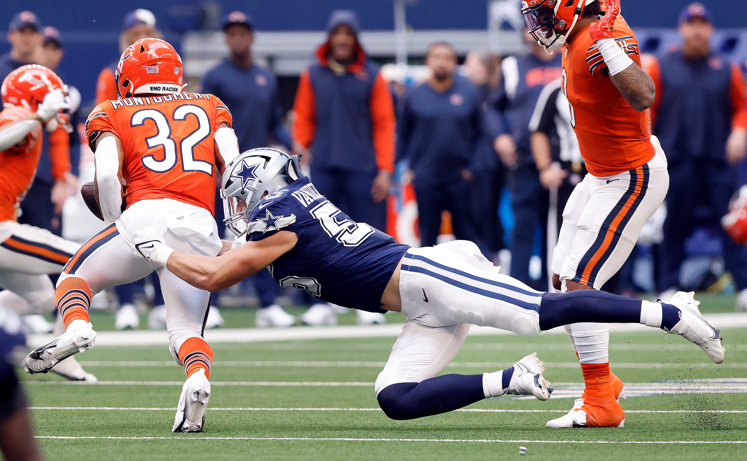 Dallas Cowboys linebacker Leighton Vander Esch (55) strips the ball from Chicago Bears...