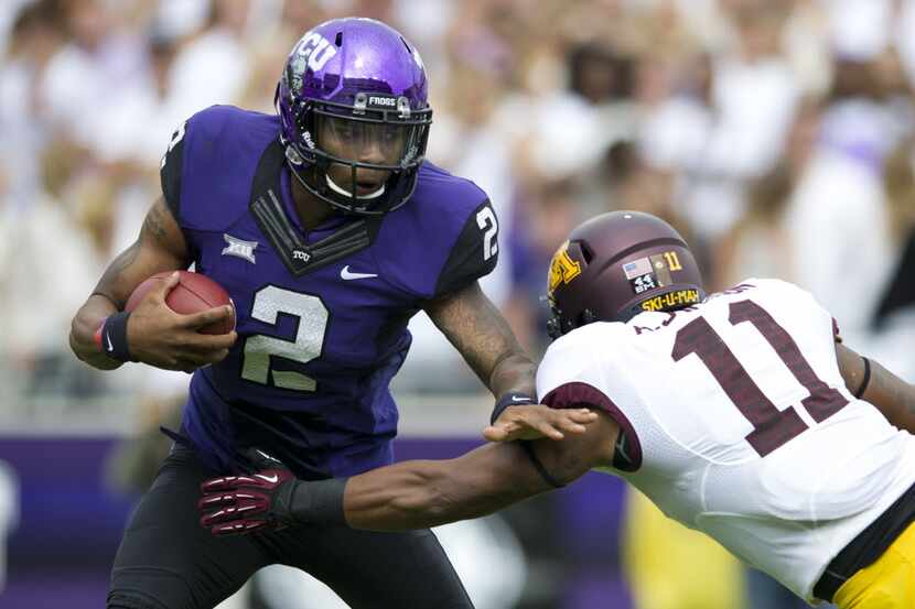 FORT WORTH, TX - SEPTEMBER 13: Trevone Boykin #2 of the TCU Horned Frogs breaks a tackle...