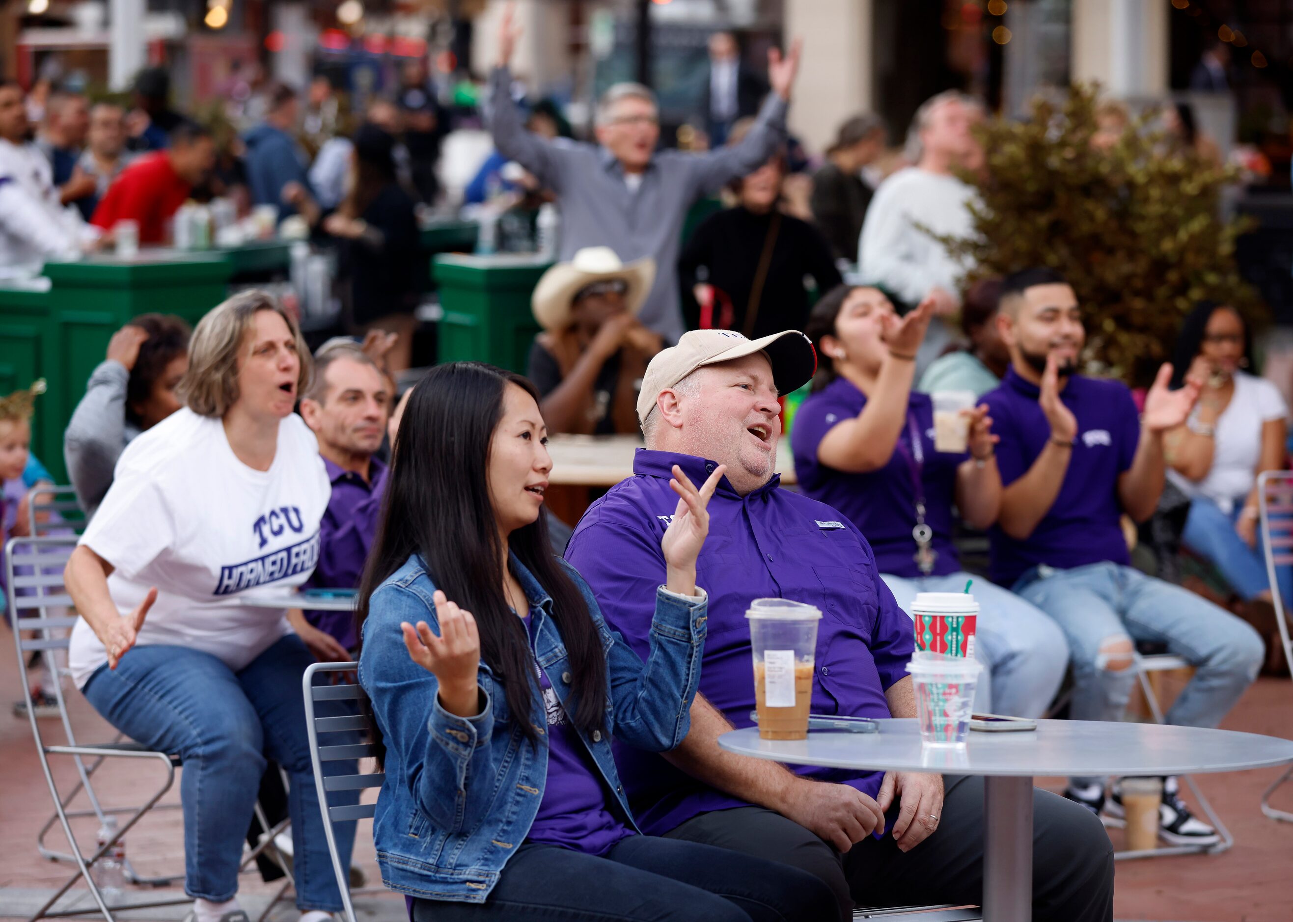 TCU Horned Frogs fans reacts to a late first half play during an outdoor CFP watch party at...