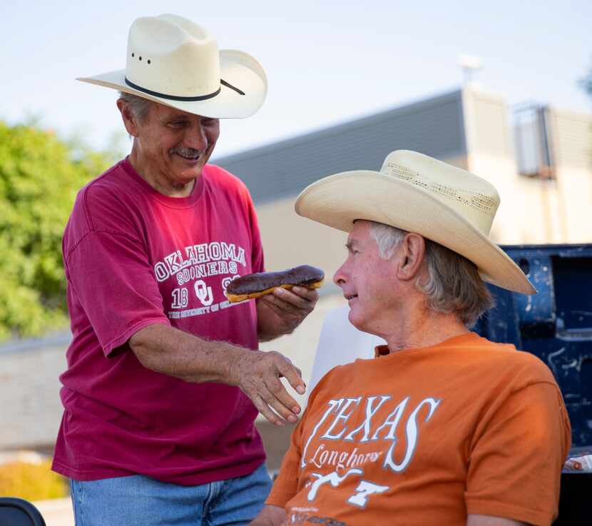 John Millsaps (left) jokes about using Jimmy Bellomy's Texas shirt as a napkin while they...