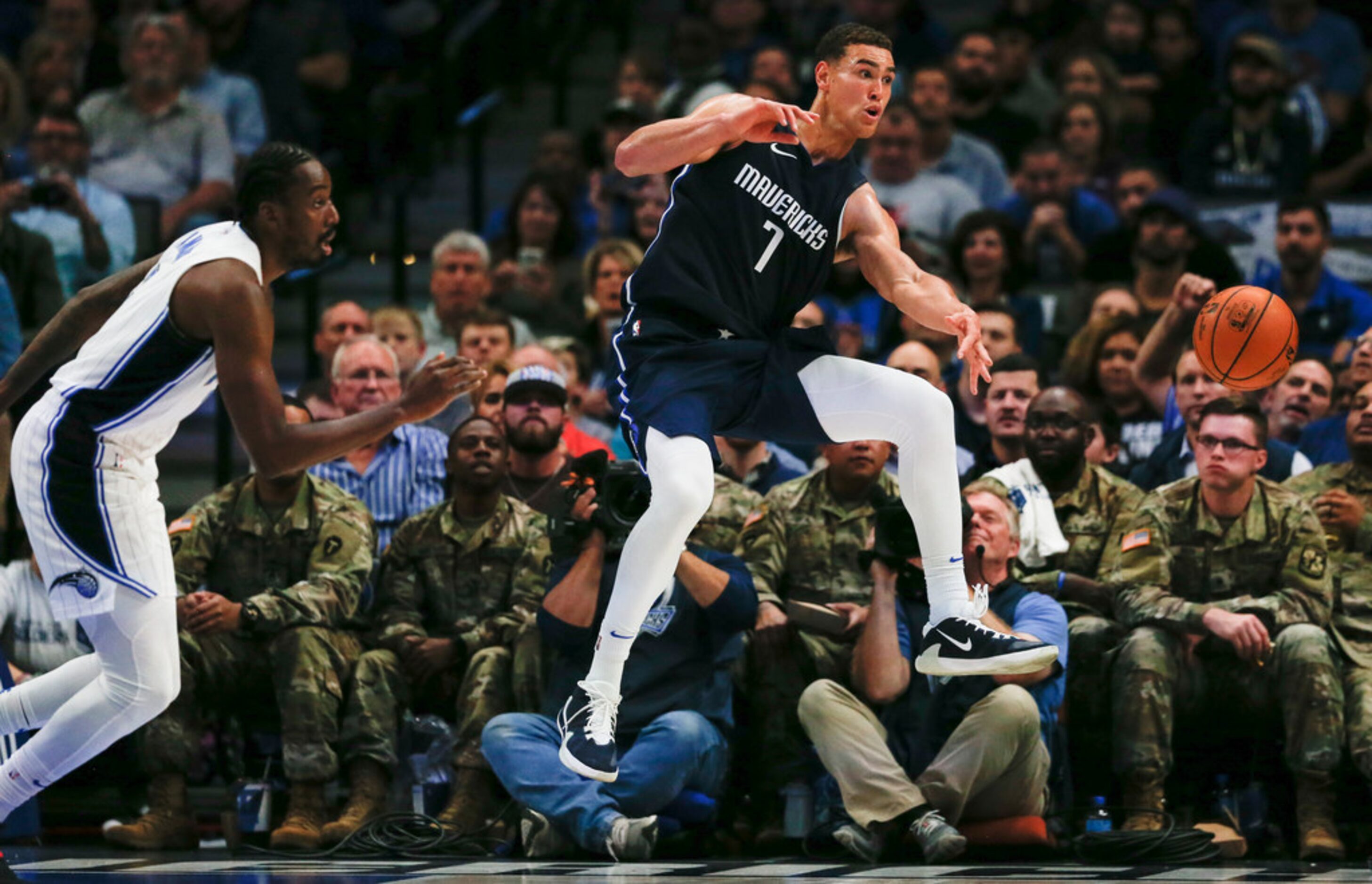 Dallas Mavericks forward Dwight Powell (7) saves the ball from going out of bounds during...