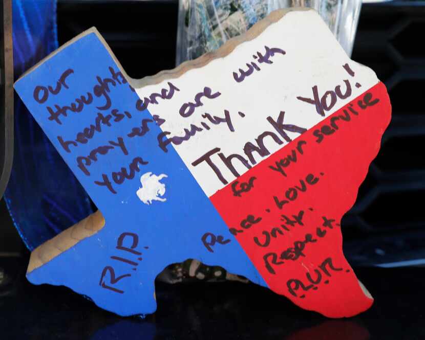 A wooden thank you note was placed on a police vehicle at Richardson police headquarters on...