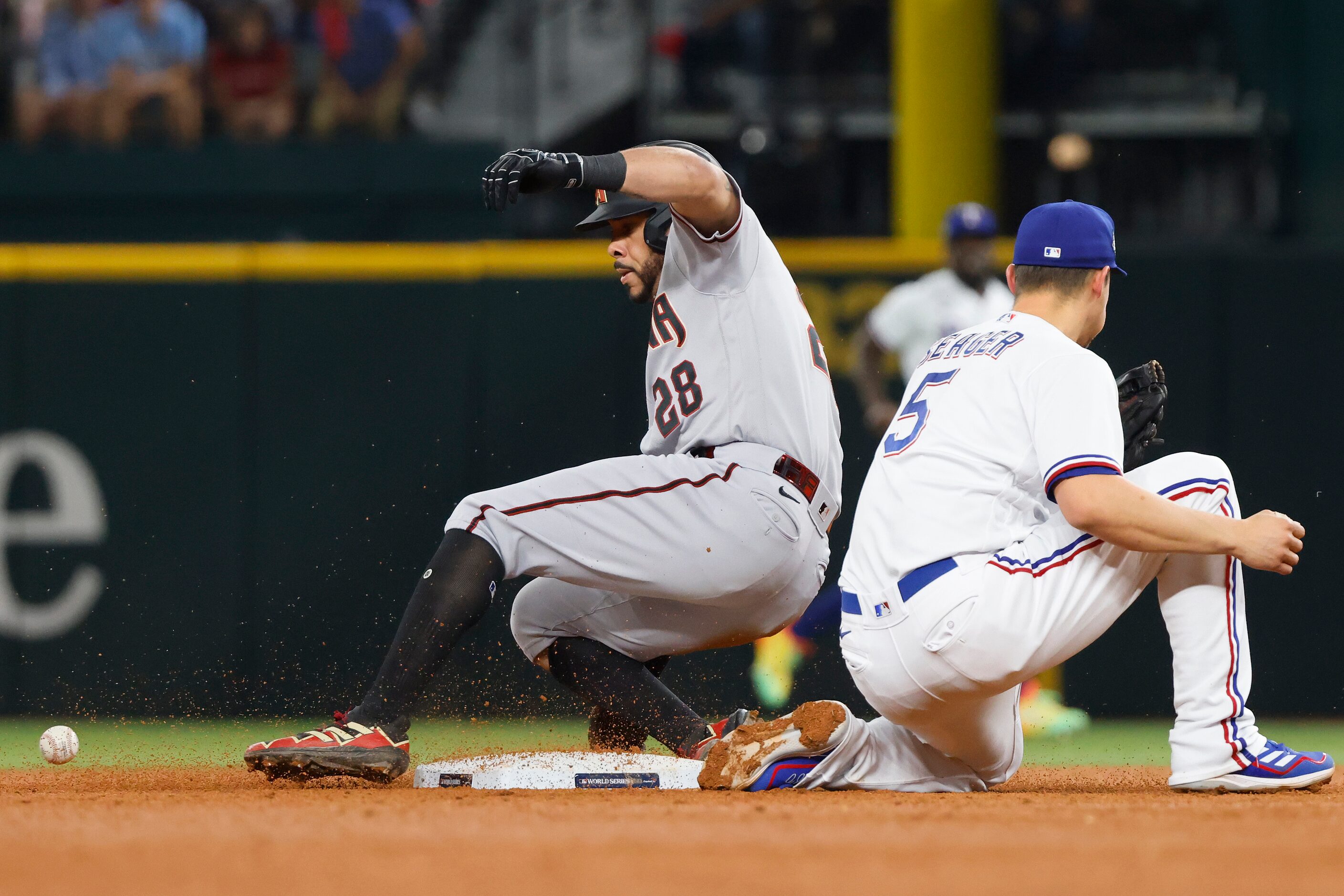 Arizona Diamondbacks designated hitter Tommy Pham (28) slides into second base with a double...