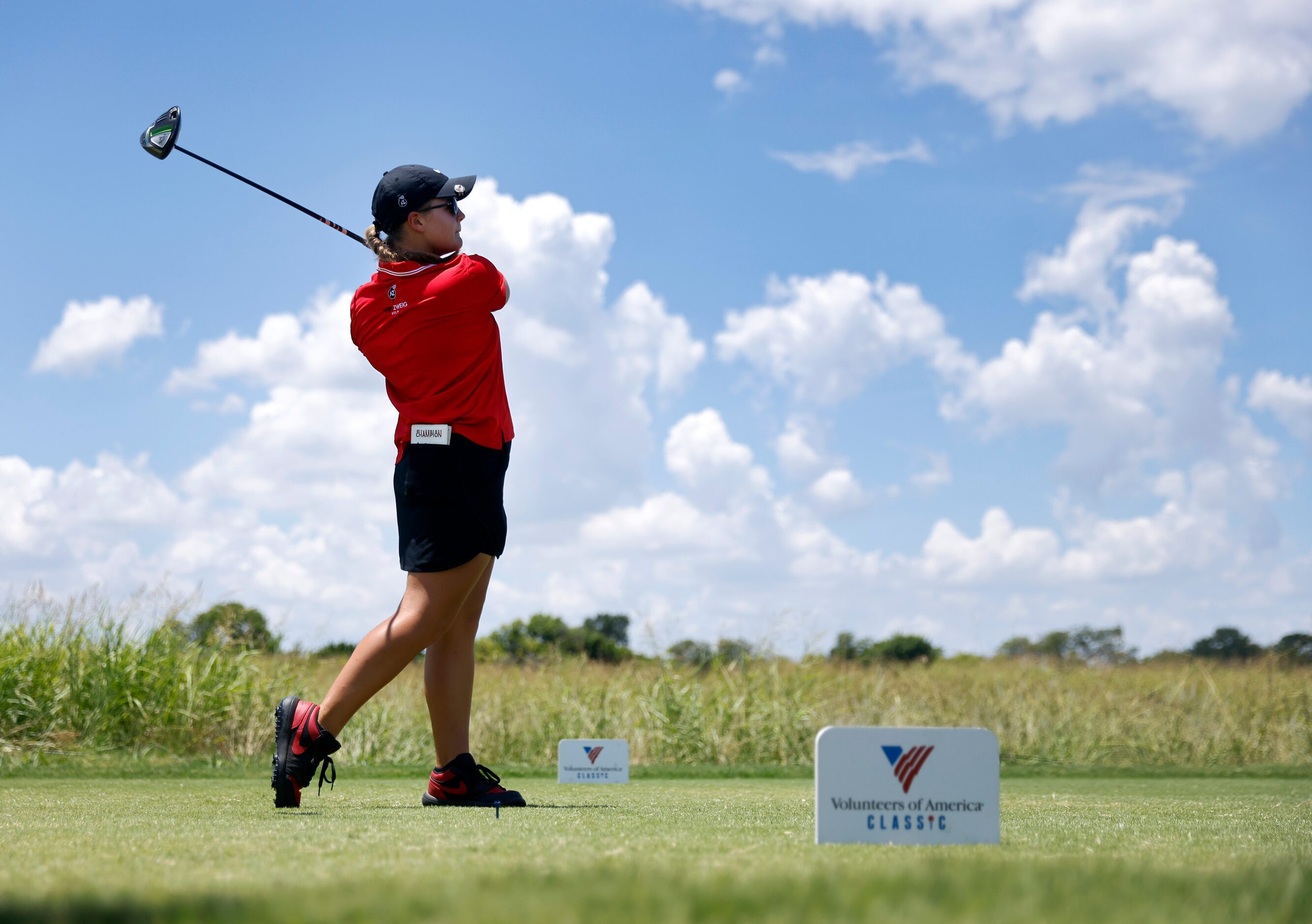 Amateur golfer Avery Zweig, 14, of McKinney tees off on No. 1 during her opening round of...