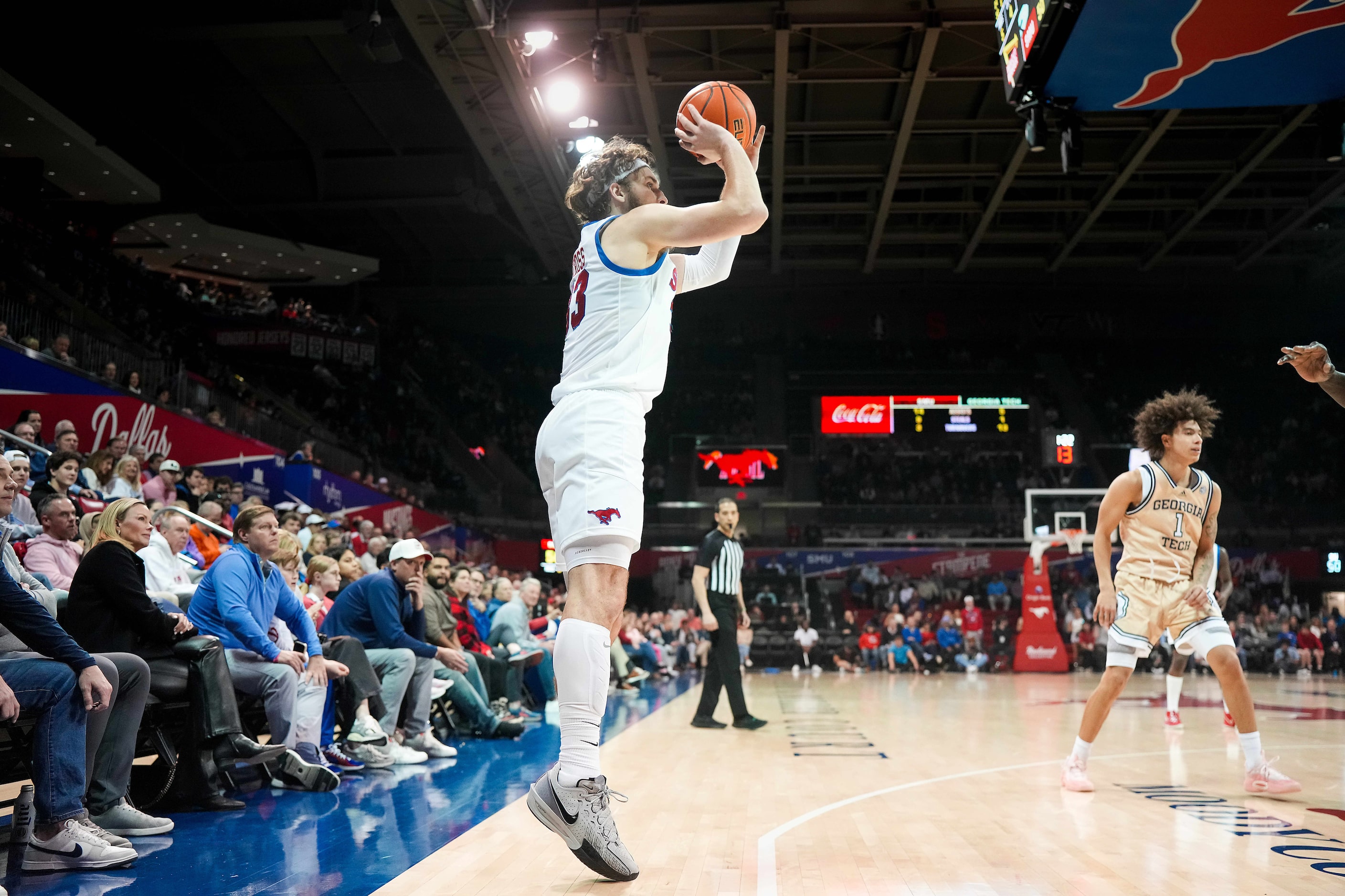 SMU forward Matt Cross (33) shoots a 3-pointer during the first half of an NCAA men’s...