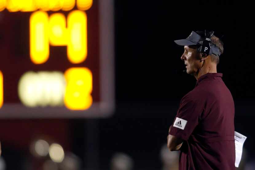 Ennis Lions head coach Sam Harrell watches first half action against Royse City from the...