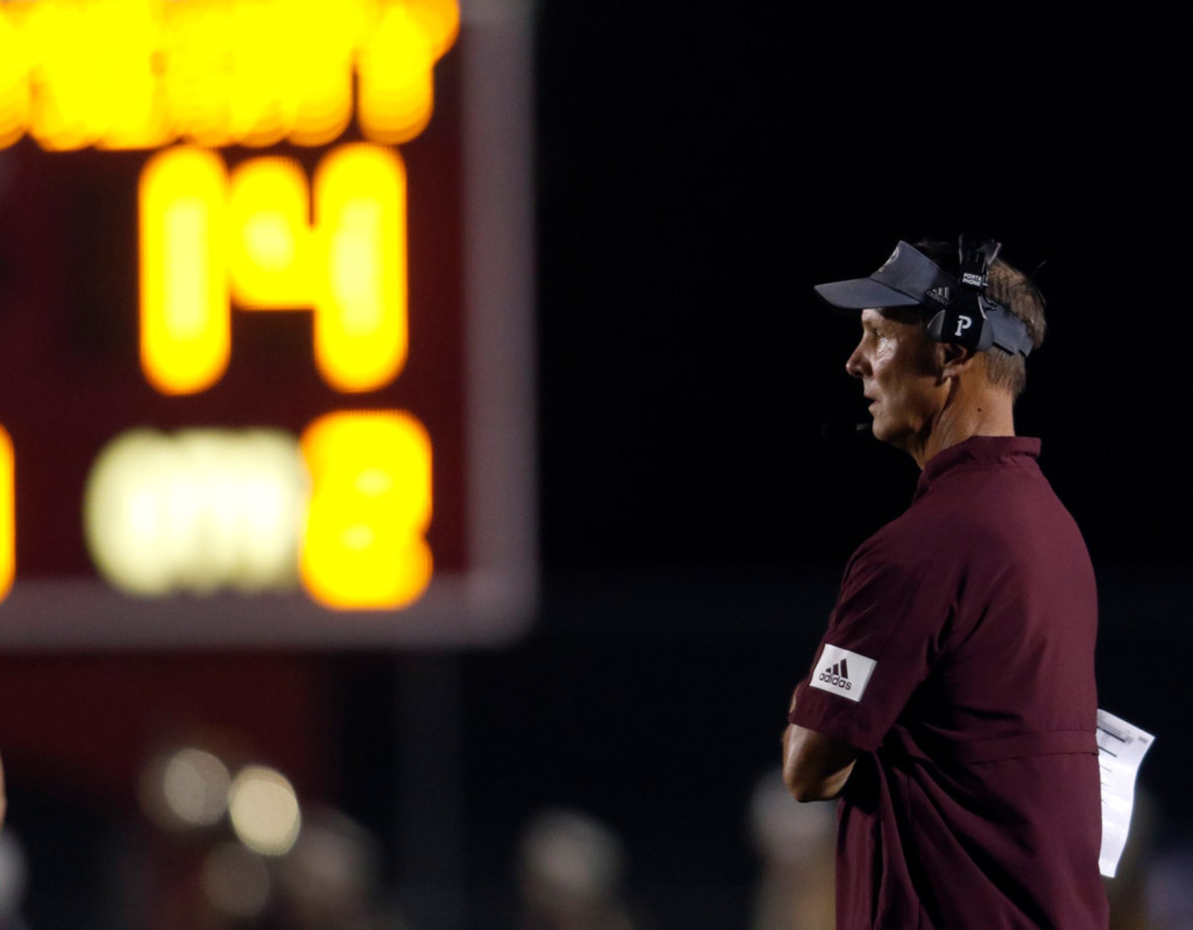 Ennis Lions head coach Sam Harrell watches first half action against Royse City from the...