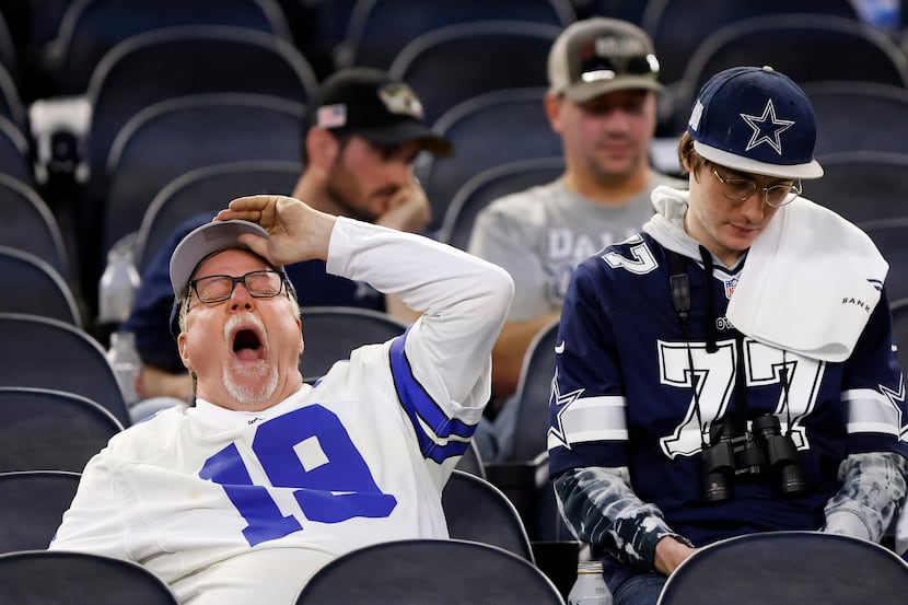 A Dallas Cowboys fan who stuck around after the NFL wild-card playoff game takes a big yawn...