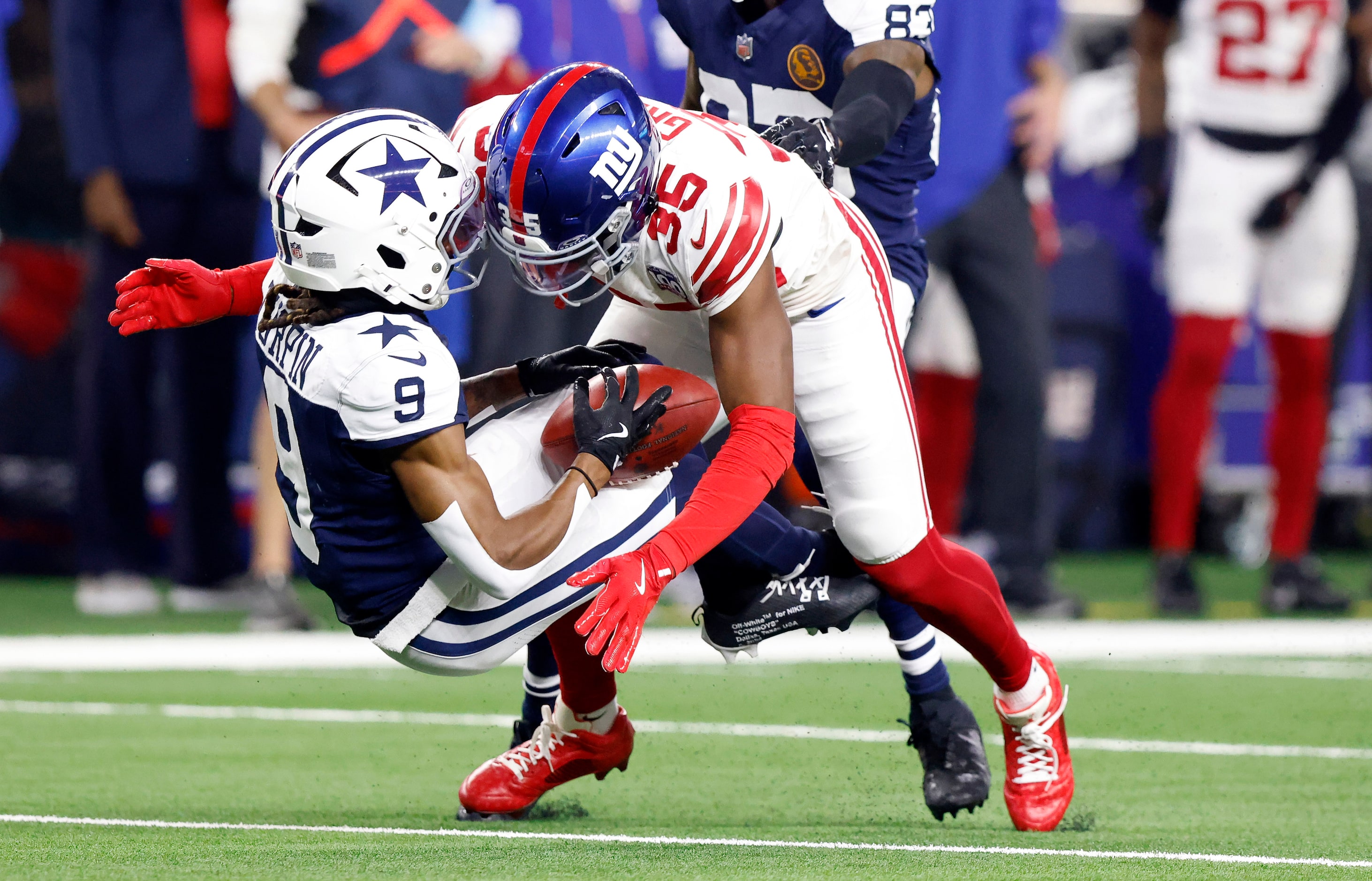 Dallas Cowboys wide receiver KaVontae Turpin (9) is leveled by New York Giants cornerback...