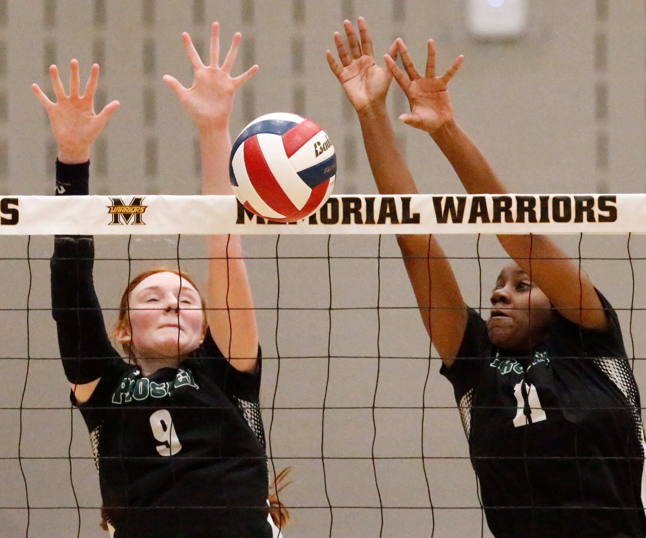 Prosper High School middle hitter Ella Chaney (9) and Prosper High School middle hitter...