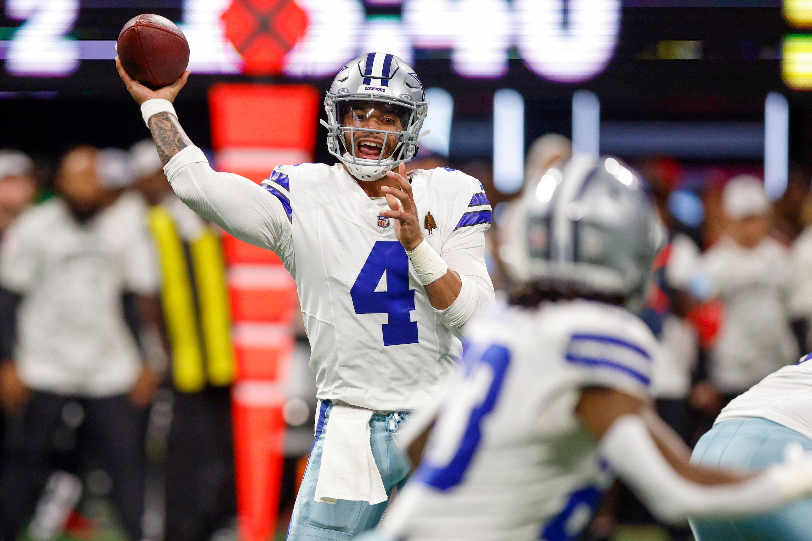 Dallas Cowboys quarterback Dak Prescott (4) throws a pass to running back Rico Dowdle during...