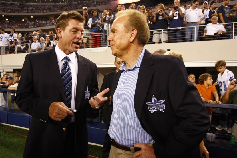 Former Dallas Cowboys QBs and Ring of Honor members Troy Aikman (L) and Roger Staubach chat...
