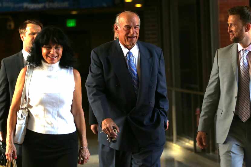Former Minnesota Gov. Jesse Ventura, center, arrives at court with his wife, Terry, and...