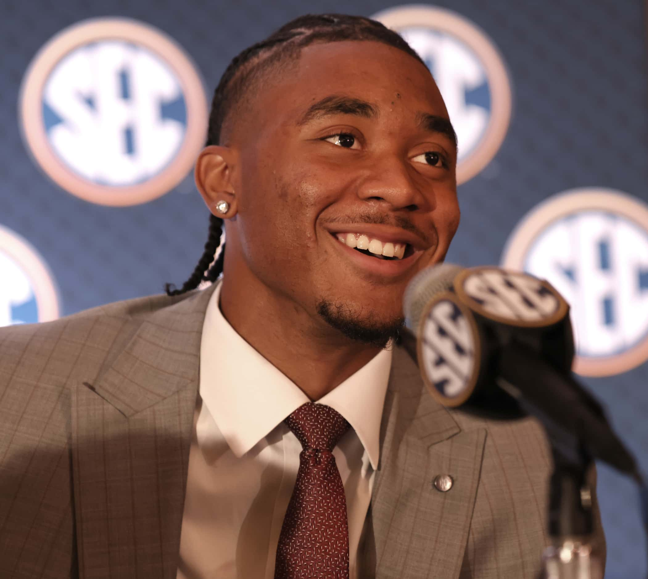 Arkansas quarterback Taylen Green sports a smile as he converses with media members during...