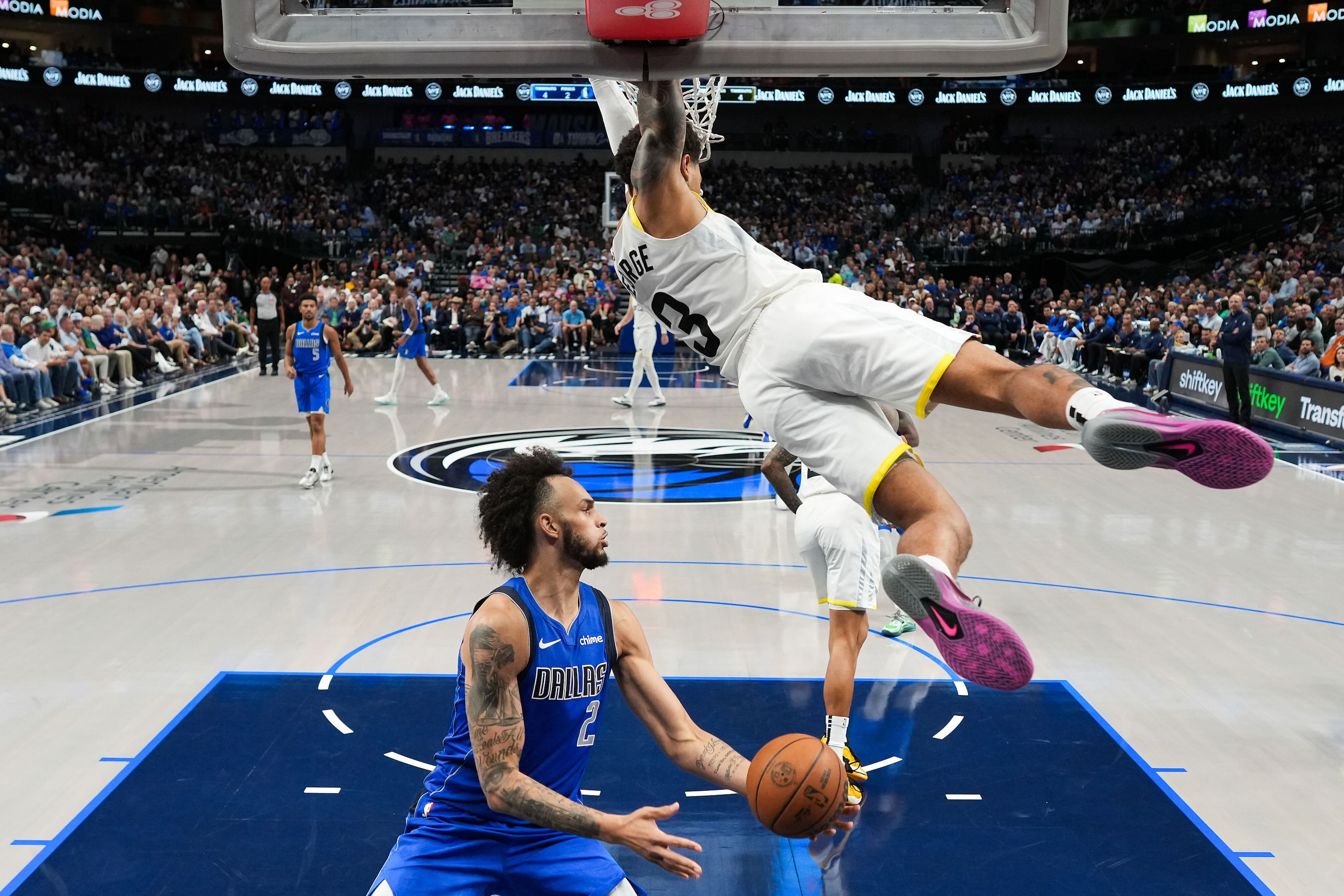 Utah Jazz guard Keyonte George (3) hands from the rim after a dunk past Dallas Mavericks...