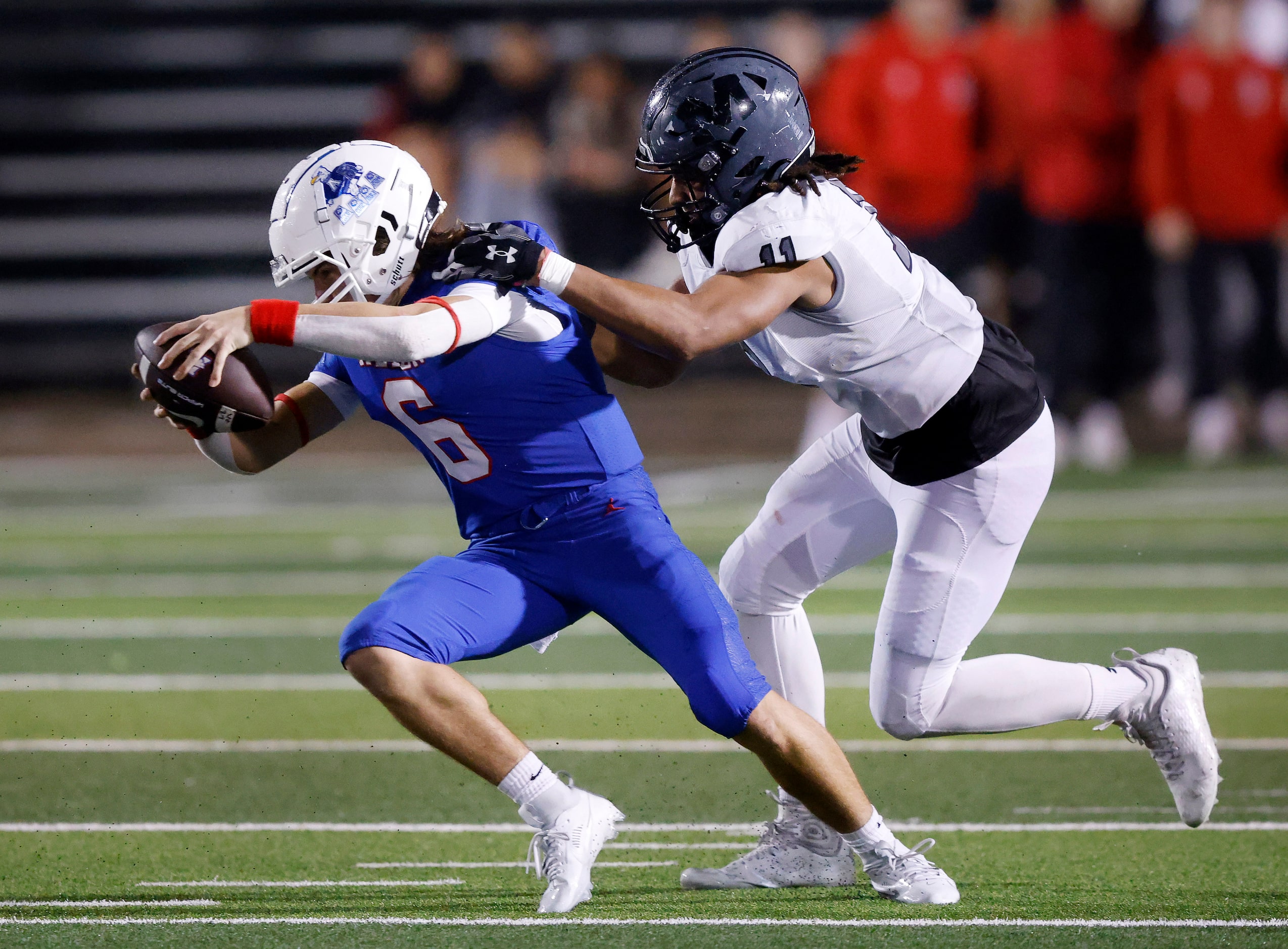 Allen quarterback Dylan Chapman (6) is slung down for a sack by Arlington Martin defensive...