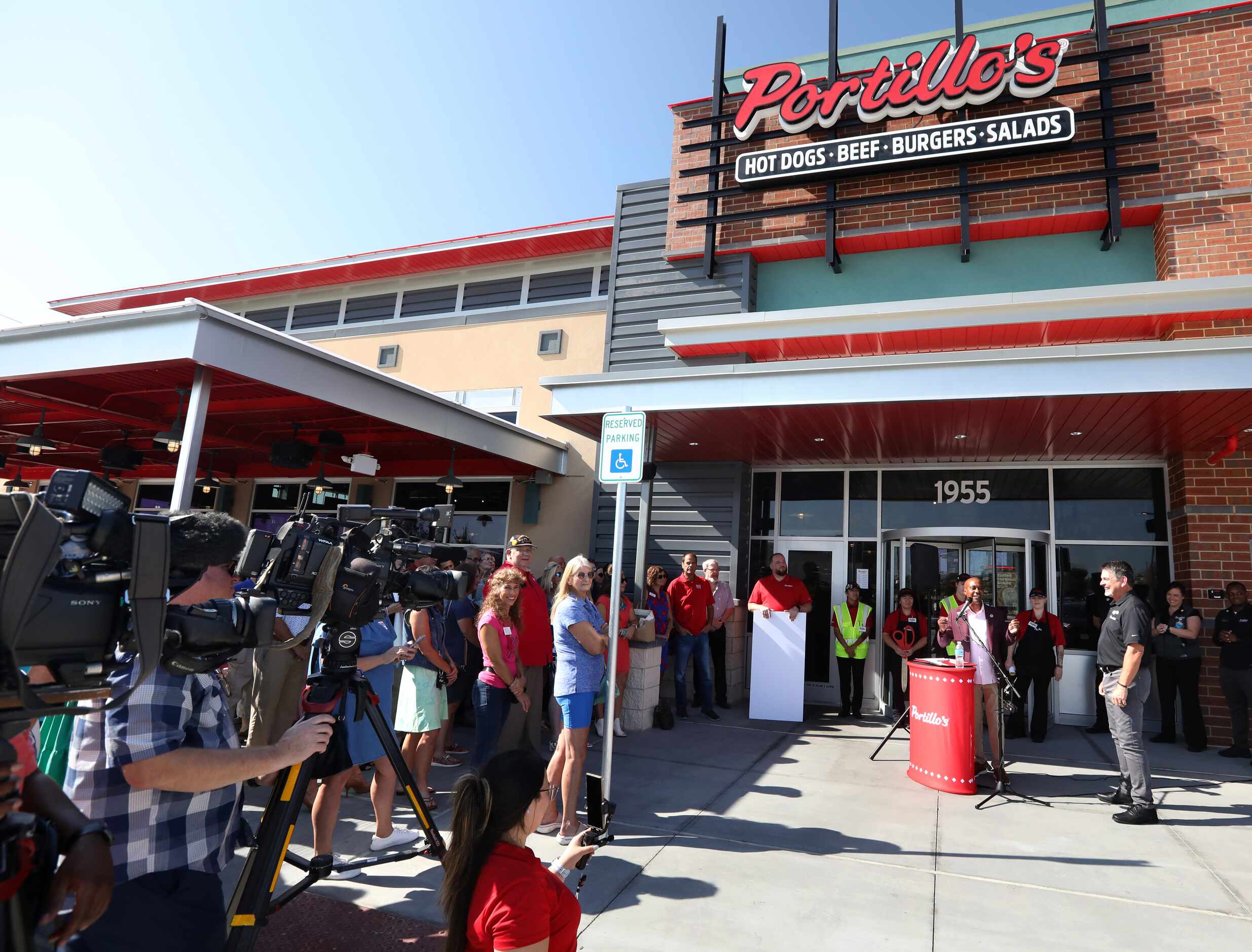 Allen mayor Baine Brooks speaks during the grand opening at Portillo's in Allen on Sept. 7,...