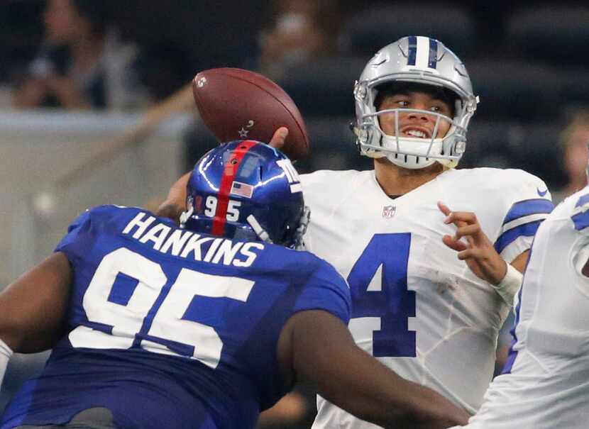 Dallas Cowboys quarterback Dak Prescott (4) throws a pass as New York Giants defensive...
