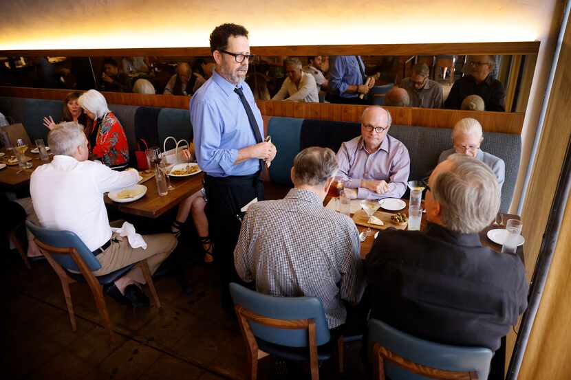 Server David Walsh waited on a table at the nearly full Nonna restaurant in Dallas on Friday...