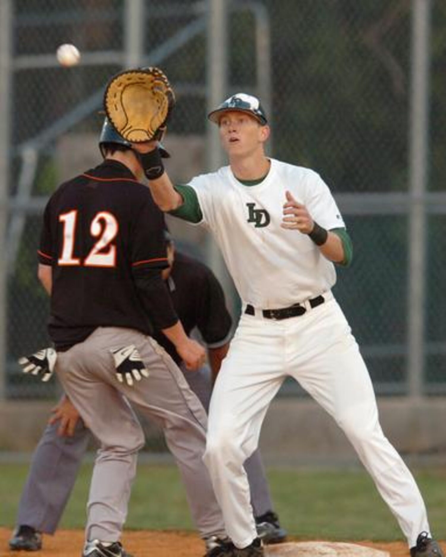 Lake Dallas' Matt Decker (4) gets the throw trying to tag out Aledo's Matt Bishop (12),...