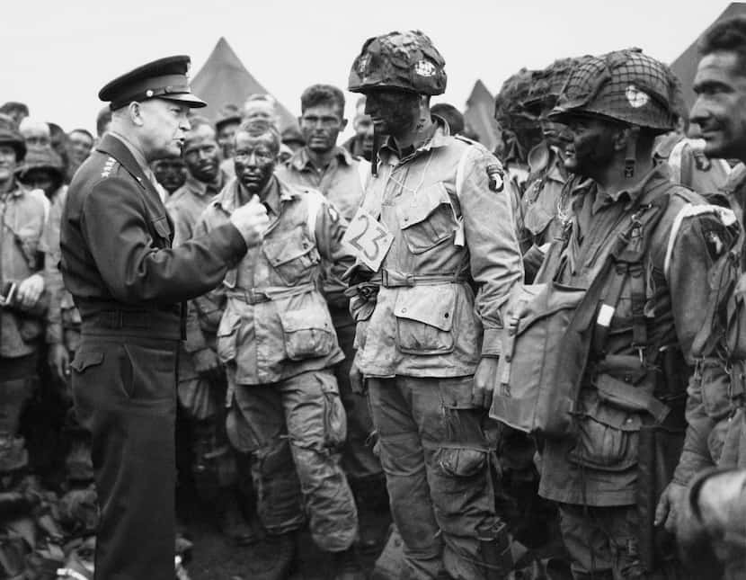 Supreme Allied Commander Gen. Dwight D. Eisenhower speaks with American paratroopers at an...