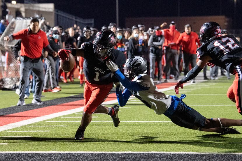 Coppell senior wide receiver KJ Liggins (1) fights through the tackle of Plano West senior...