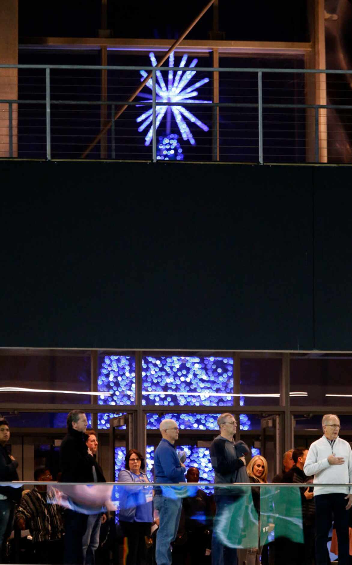 The Star Centre's giant Christmas tree can be seen through the Ford Center's window, as fans...