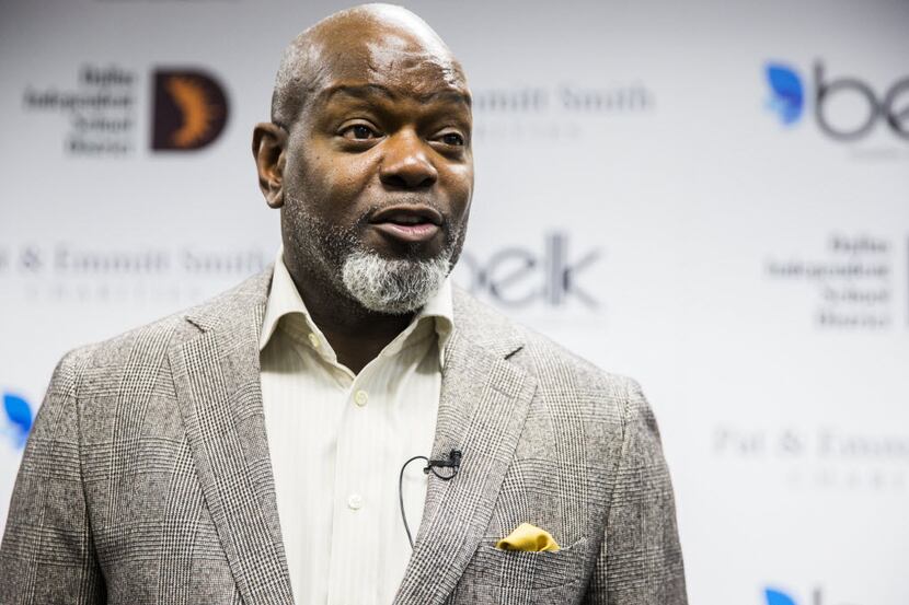 Emmitt Smith answers questions from the media during an event hosted by Pat & Emmitt Smith...