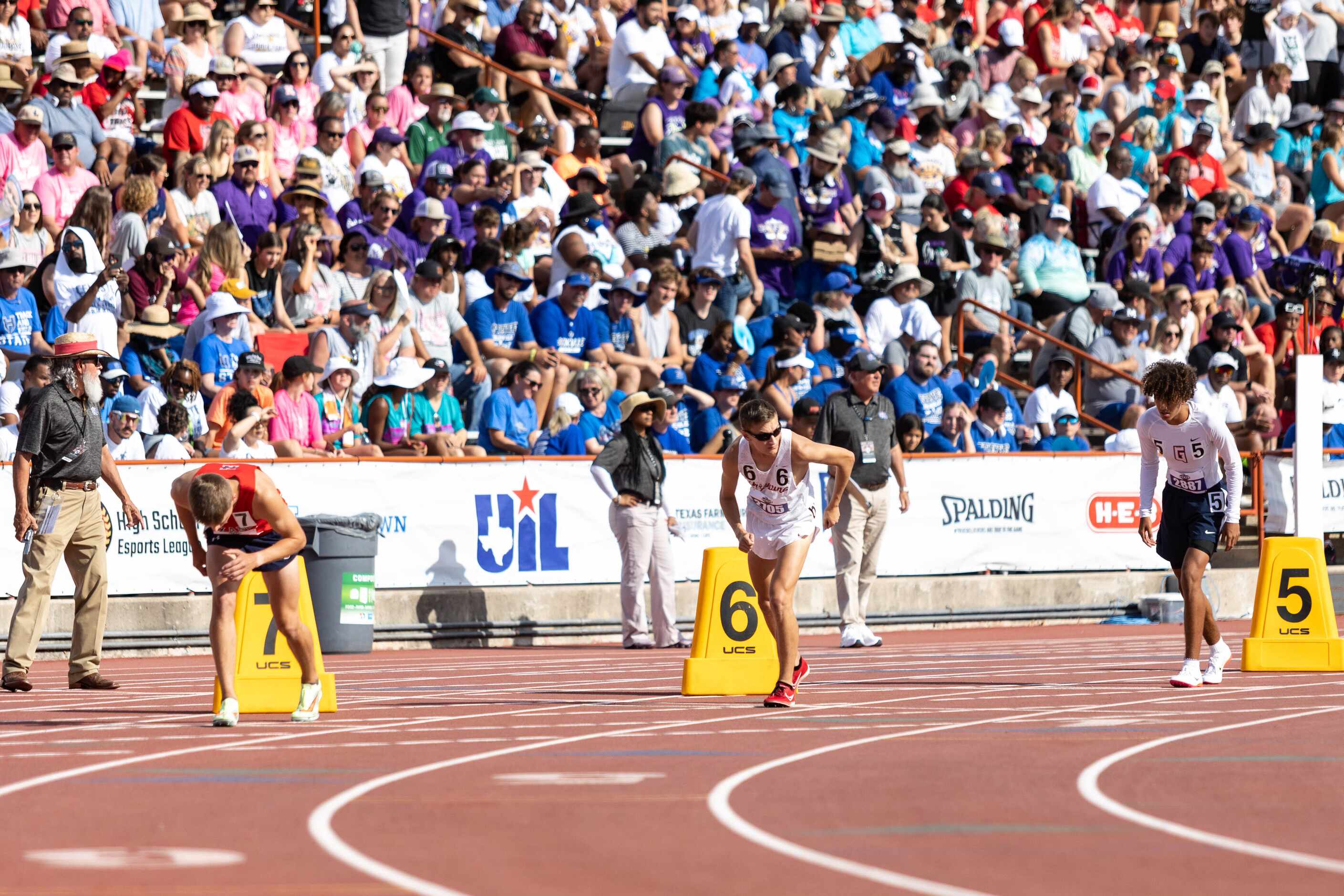 Walker St. John of Grapevine, center, prepares to race in the boys’ 800m final at the UIL...