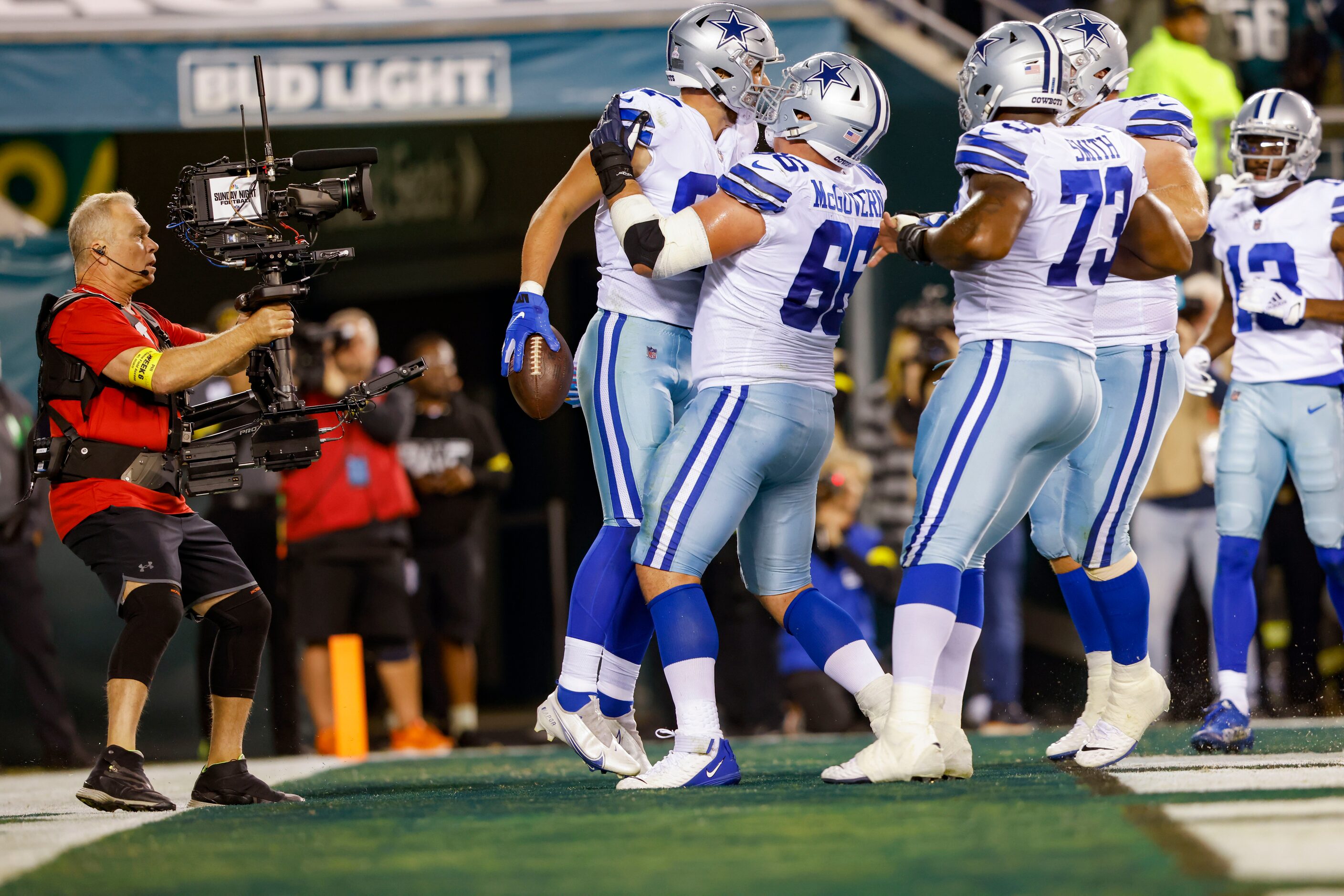 Dallas Cowboys tight end Jake Ferguson (87) celebrates a touchdown with Dallas Cowboys guard...